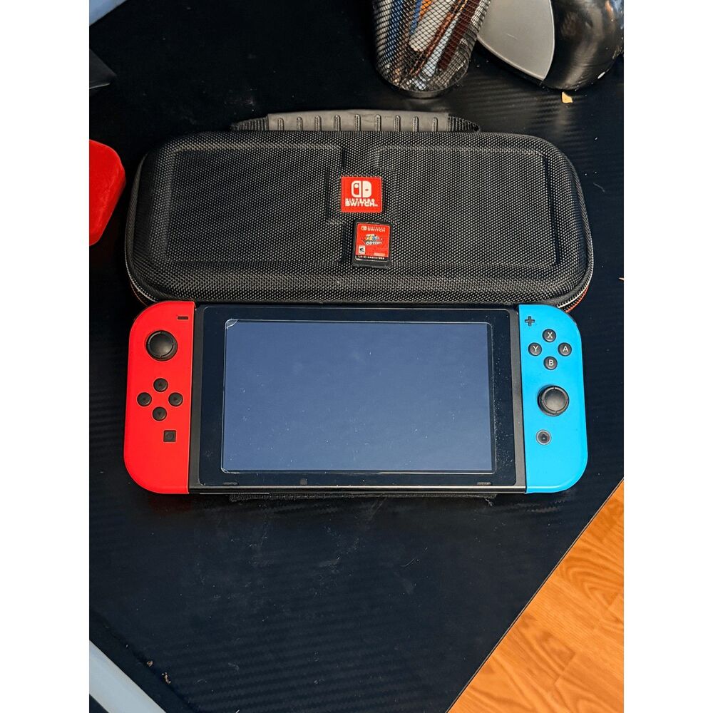 Nintendo switch with Super Mario galaxy and caring case With Screen Protector!